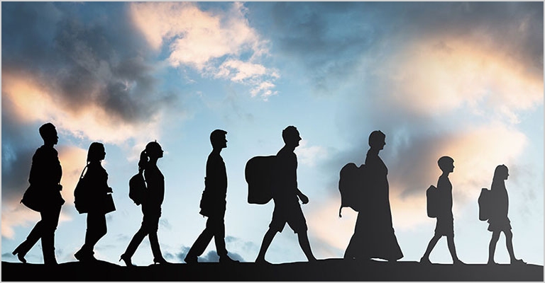 Silhouettes of people, with backpacks, walking in a line to the right, led by children